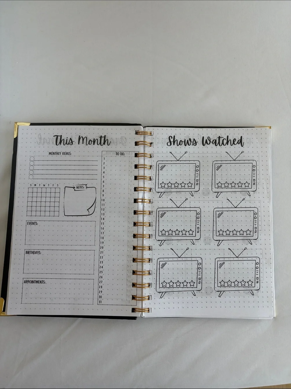 Bullet Journal Game Spiral Notebook in Black with Colored Pencils